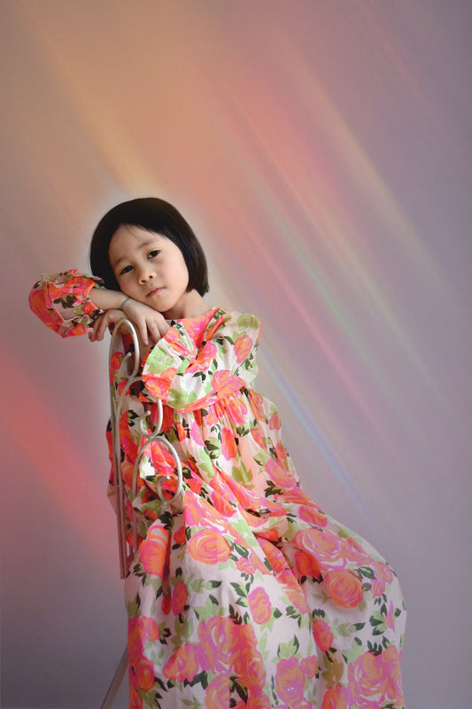 lulaland No.15 Mirage- Girl sitting on a vintage chair wearing a long flower dress