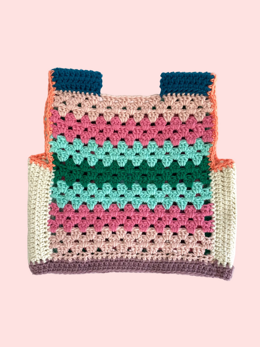 Colorful crocheted child vest with a striped pattern
