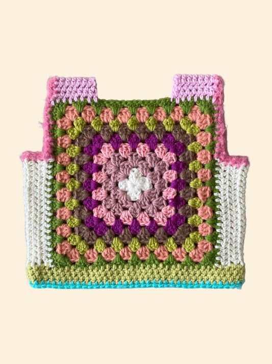 Colorful crocheted child vest with a pattern