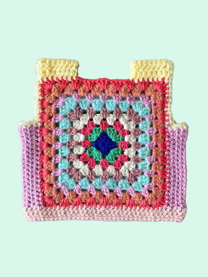 Crocheted kid vest with a colorful pattern 