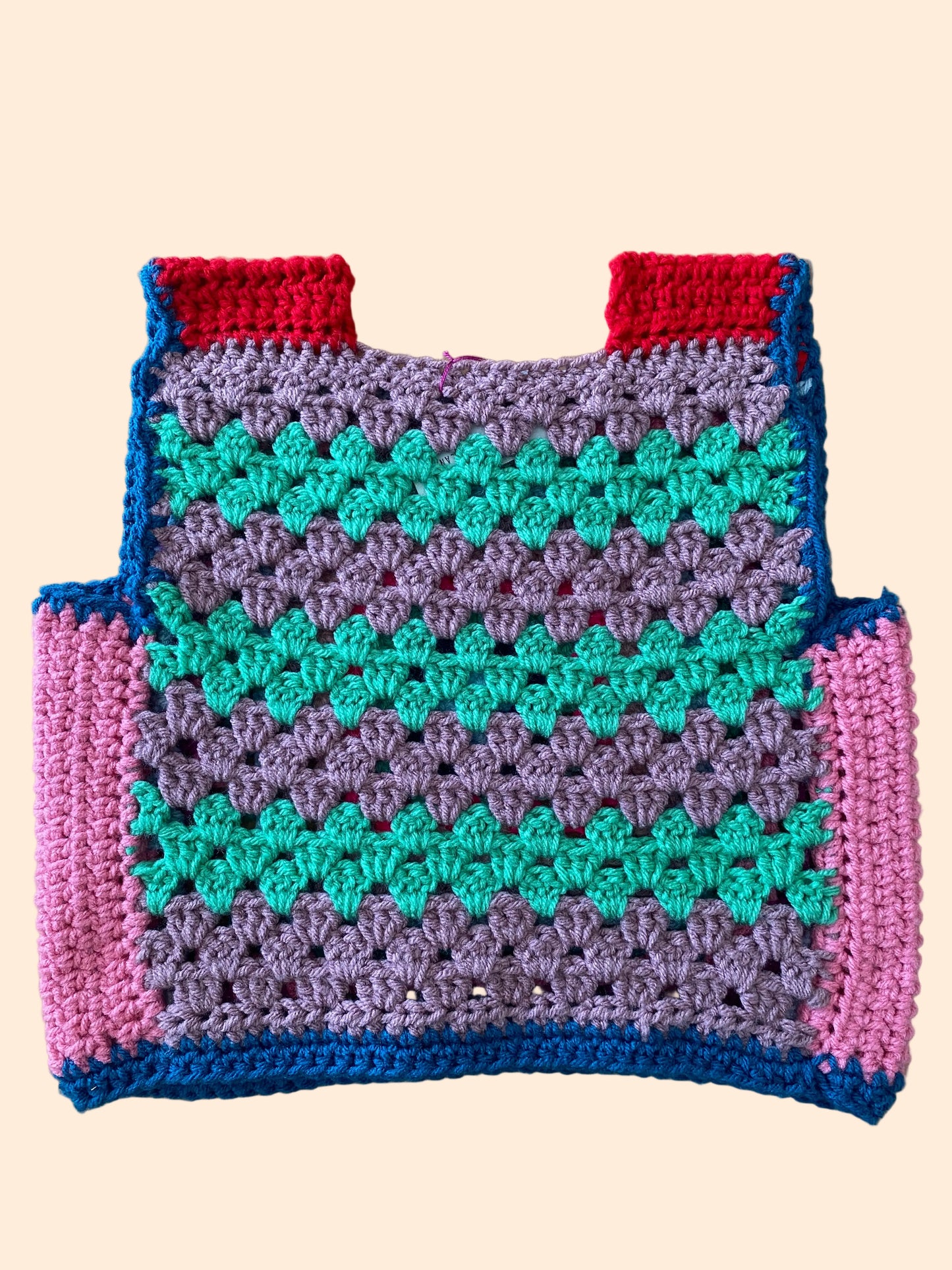 Colorful crocheted vest with a geometric pattern