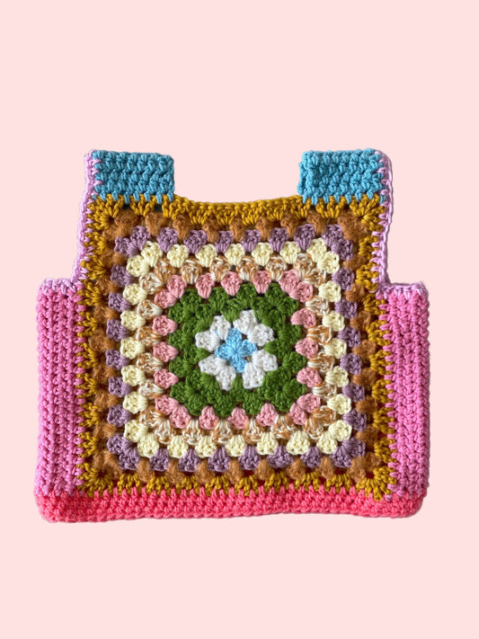 Colorful crocheted square vest with a gradient of colors 
