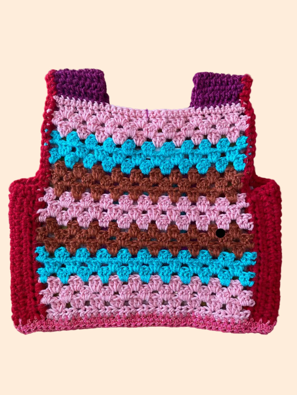 Colorful crocheted vest  with a geometric pattern