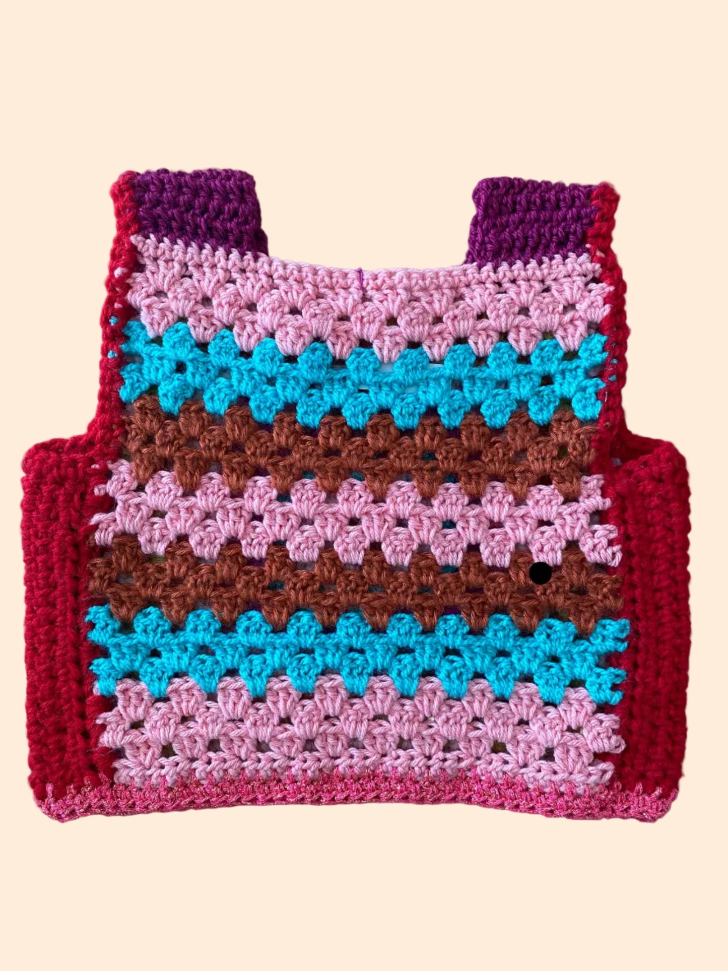 Colorful crocheted vest  with a geometric pattern