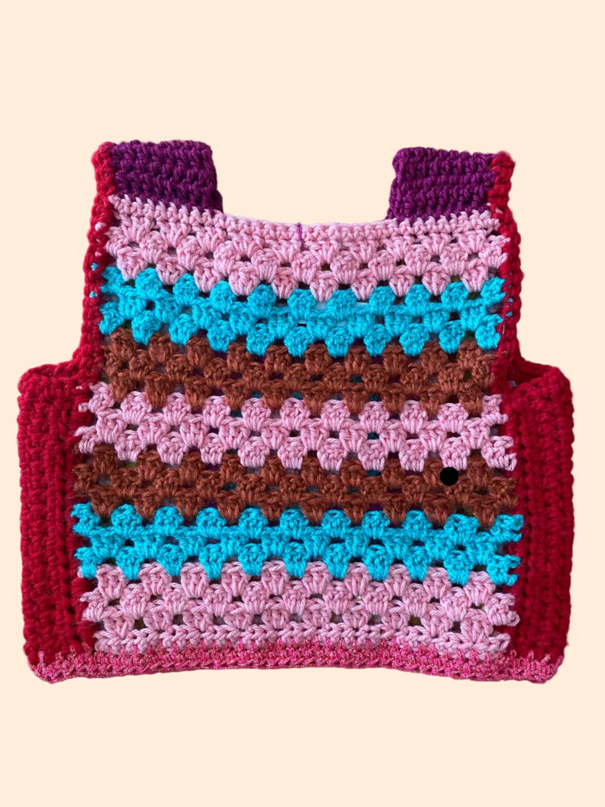 Colorful crocheted vest  with a geometric pattern