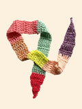 Colorful knitted scarf on a white background