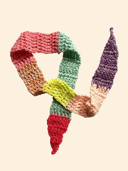 Colorful knitted scarf on a white background