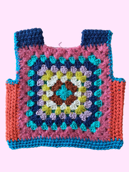 Colorful crocheted child vest with a geometric pattern 